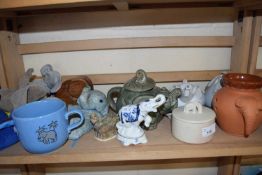 Quantity of ceramics and carved wooden models including novelty teapots etc