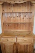 Pine cabinet with shelves above, drawers and cupboards below, 105cm wide