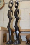 Two large carved wooden models, abstract figures