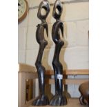 Two large carved wooden models, abstract figures