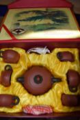 Chinese box containing a Yixing type teapot and other items