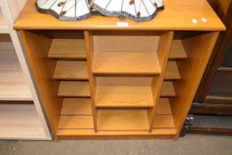 Bookcase with central sliding three tier shelf to front, 74cm wide