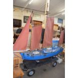 Large three mast model boat on a four wheel hand trailer, boat is approx 210cm long, appears to have