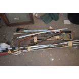 Quantity of assorted garden tools to include spades, hoes, saws etc