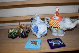 Two novelty teapots shaped as elephants together with other models of elephants