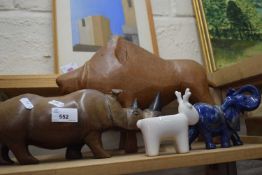 A heavy carved wooden model of a hippo plus further carved model of an elephant etc