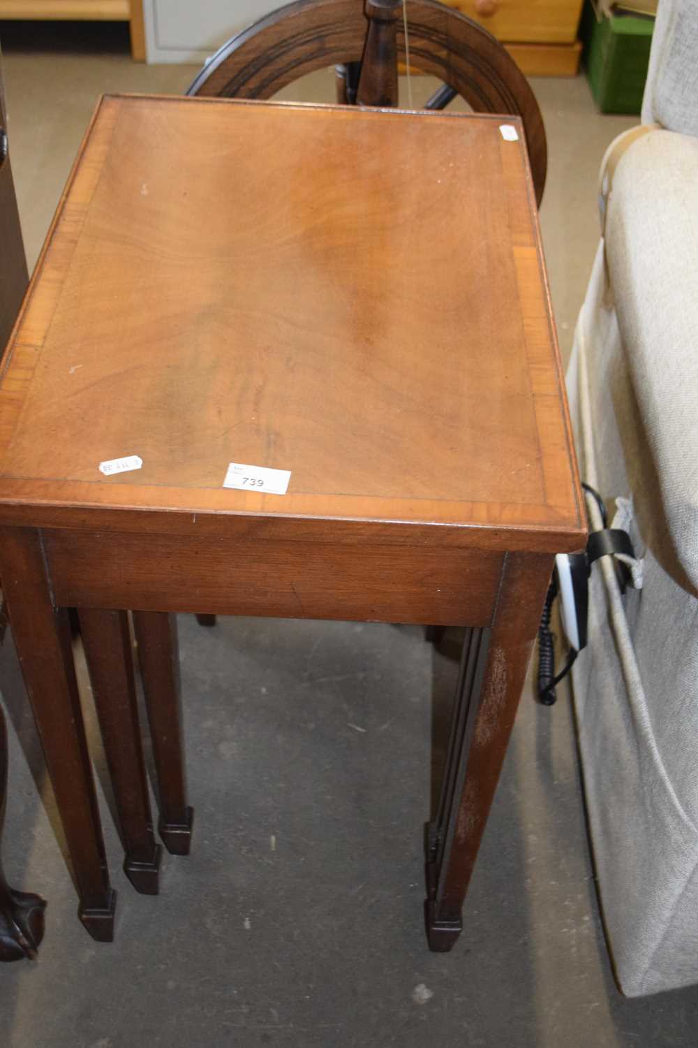 Nest of three veneered coffee tables