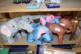 Quantity of soft toys modelled as elephants and also wooden carved elephants