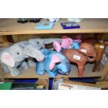 Quantity of soft toys modelled as elephants and also wooden carved elephants