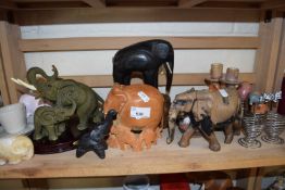 Further group of carved wooden elephants and other items