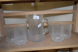 Glass water jug with six tumblers