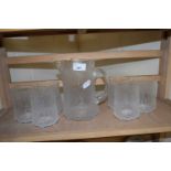 Glass water jug with six tumblers