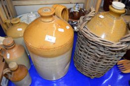 Quantity of stone ware flagons, one marked A W Buchan Portabello, Scotland in large wicker basket