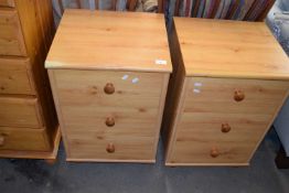 A pair of three drawer pine effect bedside cabinets, 45cm wide each