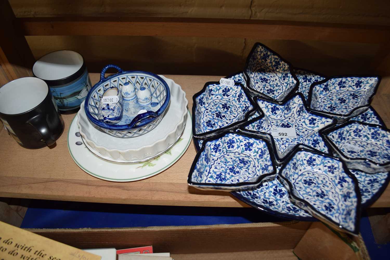 Set of ceramics, mugs, circular tray with small dishes in blue and white design