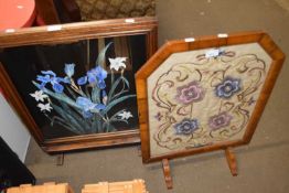 A needlework fire screen and a painted fire screen (2)