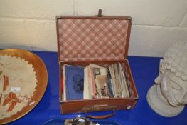 Small case containing various postcards, photographs and other ephemera