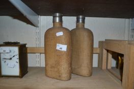 Pair of bottles with woven covers