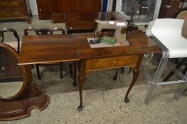 Singer sewing machine on cabriole legged stand