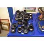 Two trays of Prinknash pottery, jugs, tankards and other items