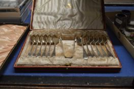 Case of silver plated teaspoons and sugar tongs