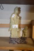 20th Century Chinese polished stone figure of an immortal, 24cm high
