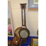 An oak cased barometer