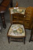 An Edwardian bedroom chair with floral upholstery