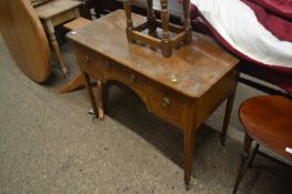 Small 19th Century mahogany side table with three drawers and tapering legs with brass casters,