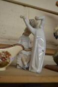 A Lladro figure and a further Nao figure (2)