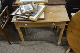A pine bow front single drawer side table
