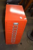 Red metal narrow set filing cabinet