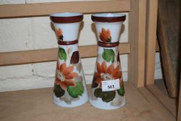 Pair of overpainted milk glass vases decorated with flowers