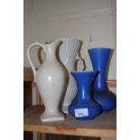 Three vases and a cream ewer