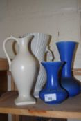 Three vases and a cream ewer