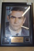 A framed and glazed presentation display, featuring an 8x10 headshot of Sean Connery as 007 James