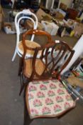 A mahogany shield back dining chair with drop in seat, a cane seated balloon back dining chair and a