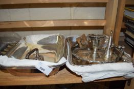 Pair of white metal entree dishes and a chamber stick and snuffer
