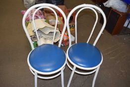 Two white metal bent wood style chairs with blue vinyl seats