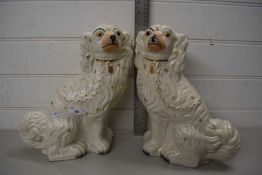 PAIR OF 19TH CENTURY CREAM STAFFORDSHIRE DOGS WITH GILT HIGHLIGHTS