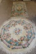 MODERN CHINESE FLORAL DECORATED CIRCULAR RUG, 130CM DIAM TOGETHER WITH A SIMILAR RECTANGULAR RUG (