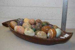 BOWL CONTAINING A COLLECTION OF POLISHED STONE EGGS