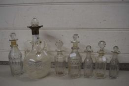 SMALL SILVER MOUNTED SPIRIT DECANTER (CRACKED), TOGETHER WITH VARIOUS CRUET BOTTLES CUT GLASS