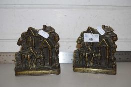 PAIR OF MOULDED BRASS BOOKENDS MARKED 'WELCOME GUEST'