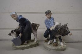 ROYAL COPENHAGEN WARES - PAIR OF FIGURES, MILKMAID WITH COW AND BOY WITH CALF