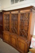 CONCAVE TRIPLE FRONT GLAZED BOOKCASE OF THREE GLAZED PANELS ABOVE AND CUPBOARDS BELOW, APPROX