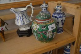 GREEN GINGER JAR AND COVER, TWO CHINESE BLUE AND WHITE VASES AND COVERS AND A BLUE AND WHITE JUG
