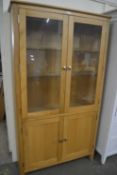 GLAZED DISPLAY CABINET WITH GLASS SHELVES ABOVE AND CUPBOARDS BELOW, APPROX 1M WIDE