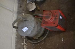 GALVANISED CHICKEN FEEDER AND A RED CANDLE LANTERN