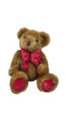 A limited edition Harrods Teddy Bear, 1997, with red and gold bow, seated height approximately:
